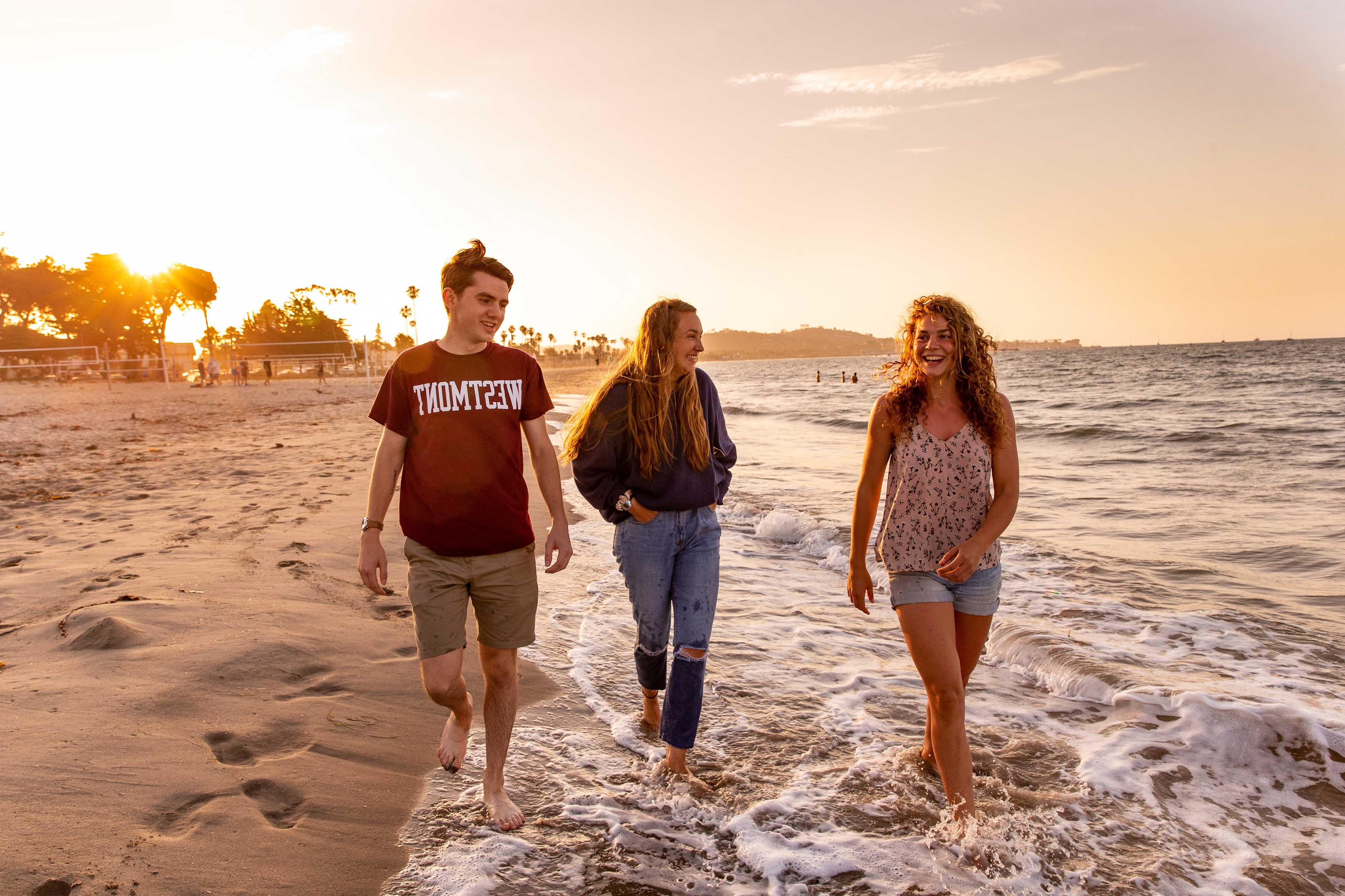 westmont students walking on beach sunset